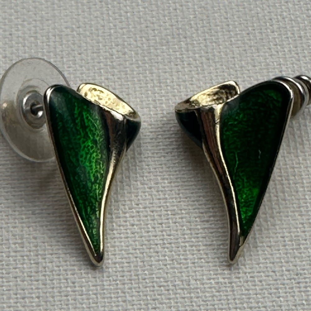 Green uniquely shaped earrings, no backs.